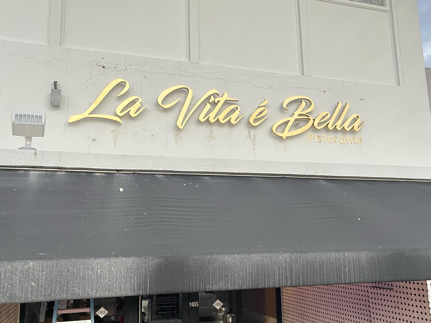 Finished gold storefront lettering, La Vita e Bella