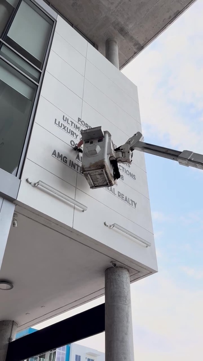 Installing illuminated building letters from a lift